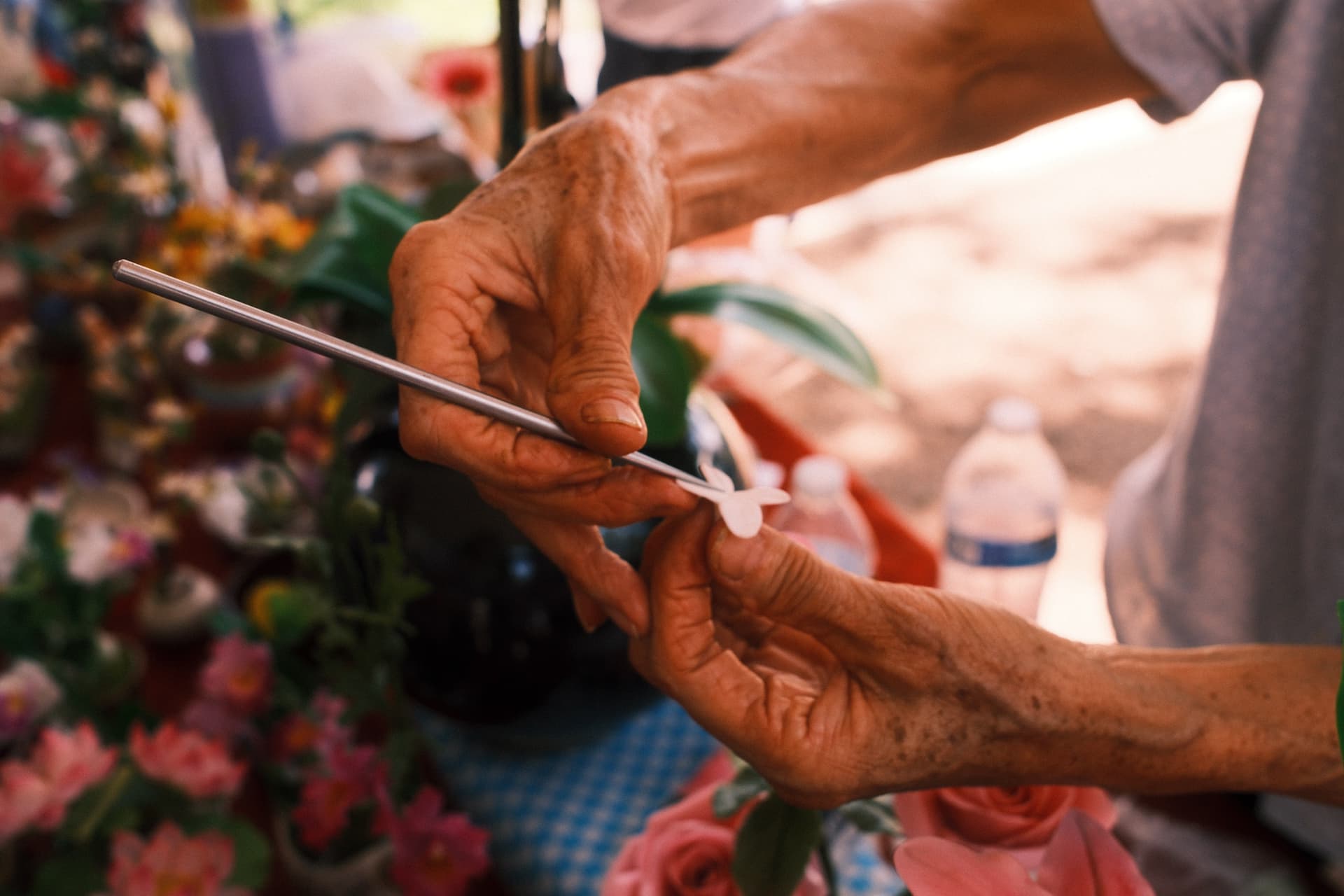 Elderly hands crafting flowers