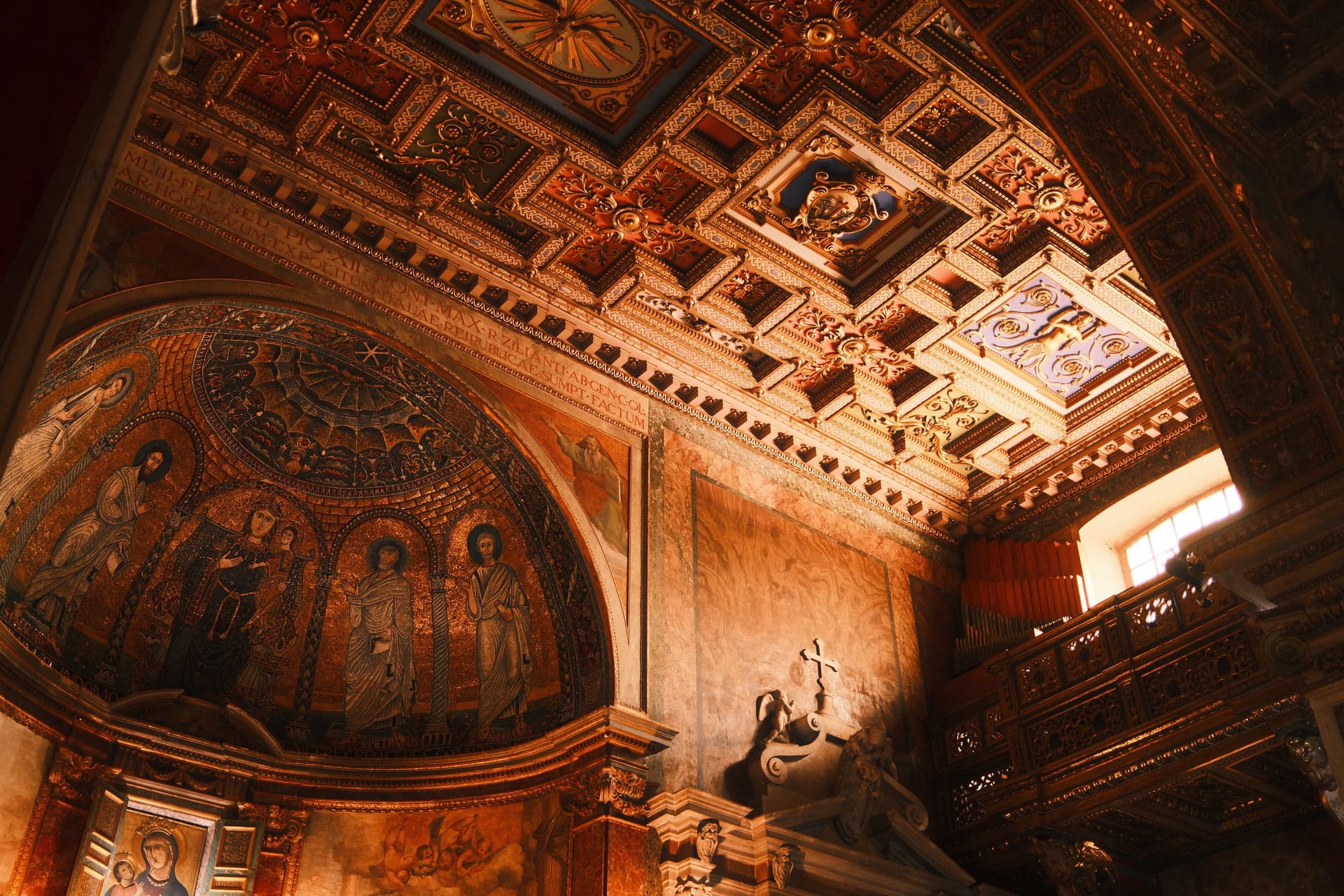 Ornate Roman church ceiling with golden details
